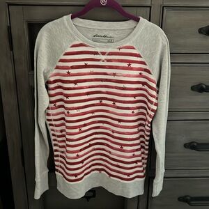 Eddie Bauer size medium, red and white stripes with red stars, gray background
